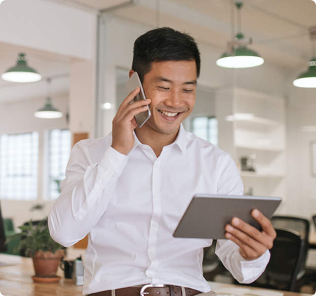 Business professional smiling while on a call
